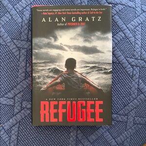 Scholastic Refugee Book - Red and Black Cover